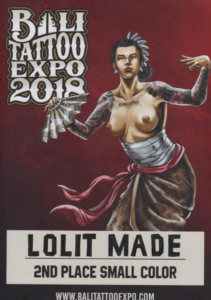 A bustling Bali street leads to a highly-rated tattoo studio, where an artist of Black descent is seen through the window, working on an intricate traditional Balinese sleeve tattoo. The studio is popular among locals and tourists alike, known for its skilled artists and welcoming atmosphere.